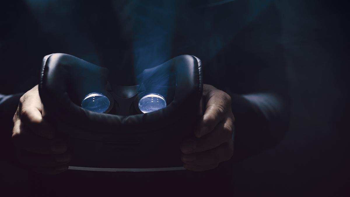 Person holding a virtual reality headset