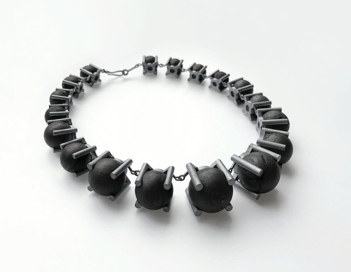 photo of a necklace made of coal and silver